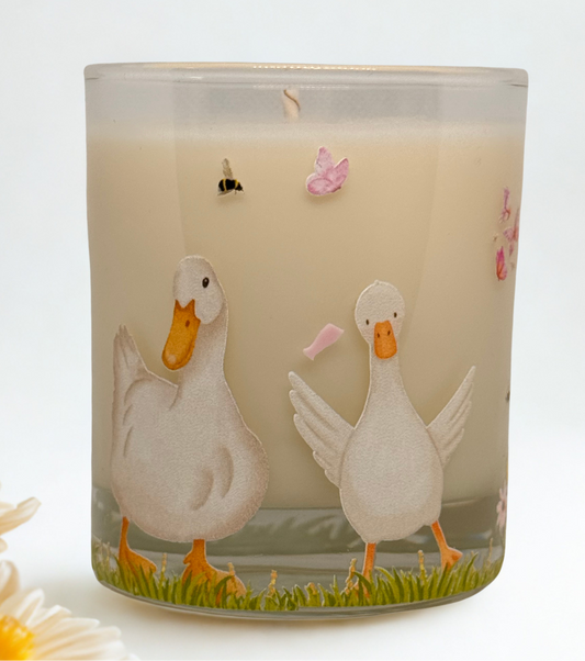 Candle with duck design on a white background